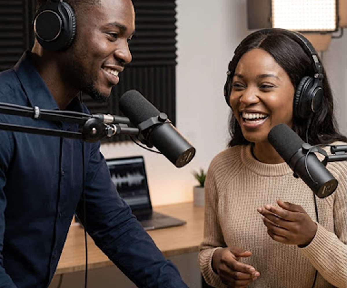 Two podcasters recording with studio microphones